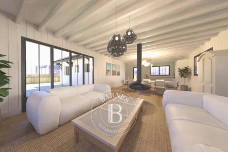 séjour lumineux avec poêle et salle à manger cap ferret immobilier de luxe